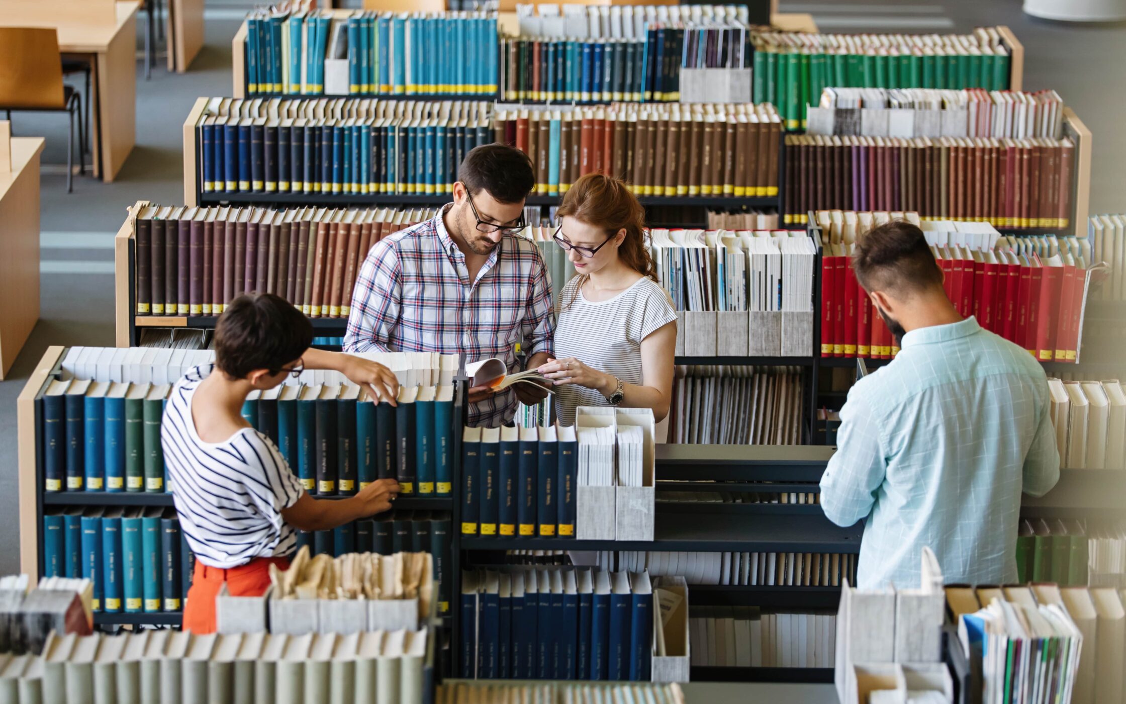 Photo of a group of yound people browsing through library of branding terms